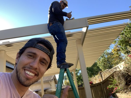 Hewson Project - The Hewson project is a tan colored rectangular shaped open lattice pergola design with a 3 foot cantilever overhand.