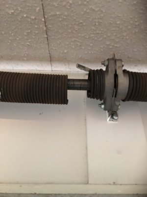 Broken Spring Repair - This customer had a broken spring. We were able to weigh the door and repair the damage with the correct spring.