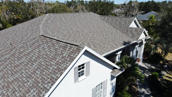 Full Roof Replacement - Shingle to Shingle - Shingle-to-shingle roof replacement completed in Sarasota, FL.
When we arrived, the existing roof had already been tarped due to significant damage and was in poor condition. The system had reached the end of its life and needed a full replacement to properly protect the home.
Our team removed the failing roof and installed GAF StormGuard® underlayment, creating a waterproof barrier designed to handle Florida’s heavy rain and wind-driven storms.
We finished the system with GAF Timberline® HDZ™ architectural shingles in the Sierra Sands color, giving the home a fresh look while delivering reliable performance backed by LayerLock® Technology.
The result is a durable, Florida-ready roof system that restores protection and dramatically improves the home’s curb appeal.
Project completed by Siesta Roofing, serving Sarasota and surrounding Southwest Florida communities. Full Roof Replacement - Shingle to Shingle - Shingle-to-shingle roof replacement completed in Sarasota, FL.
When we arrived, the existing roof had already been tarped due to significant damage and was in poor condition. The system had reached the end of its life and needed a full replacement to properly protect the home.
Our team removed the failing roof and installed GAF StormGuard® underlayment, creating a waterproof barrier designed to handle Florida’s heavy rain and wind-driven storms.
We finished the system with GAF Timberline® HDZ™ architectural shingles in the Sierra Sands color, giving the home a fresh look while delivering reliable performance backed by LayerLock® Technology.
The result is a durable, Florida-ready roof system that restores protection and dramatically improves the home’s curb appeal.
Project completed by Siesta Roofing, serving Sarasota and surrounding Southwest Florida communities.