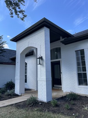 S. Austin exterior transformation - For this S. Austin home, we properly cleaned and prepped the brick and all previously painted surfaces before giving it a fresh, updated color scheme. What a transformation!
