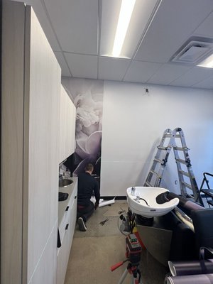 Beauty Salon Wall Mural Installation 2023 - The customer asked to decorate the wall of a beauty salon. For this project, we helped a beauty salon completely transform the atmosphere of their interior space. The customer selected a stunning floral mural to add a bold and elegant accent wall. We carefully prepared the surface, aligned the panels with precision, and applied the wallpaper to ensure a seamless, professional finish. The mural not only adds visual impact, but also creates a welcoming and stylish environment for salon clients. A beautiful upgrade with lasting results!