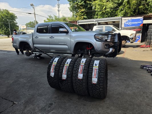 2017 TOYOTA TACOMA LIFT KIT - NEW WHEELS AND TIRES BLACK WHEELS - NITTO RIDGE GRAPPLER TIRES 295 55 20 - WHEEL ALIGNMENT. - THIS 2017 TOYOTA TACOMA CAME IN WITH BALD TIRES AND STOCK RIMS - LIFT KIT INSTALLED, BLACK 20X10 WHEELS, 295 55 20 SET OF 4 NEW NITTO RIDGE GRAPPLER TIRES, WHEEL ALIGNMENT. PERFORMED SERVICE IN 1 DAY. 2017 TOYOTA TACOMA LIFT KIT - NEW WHEELS AND TIRES BLACK WHEELS - NITTO RIDGE GRAPPLER TIRES 295 55 20 - WHEEL ALIGNMENT. - THIS 2017 TOYOTA TACOMA CAME IN WITH BALD TIRES AND STOCK RIMS - LIFT KIT INSTALLED, BLACK 20X10 WHEELS, 295 55 20 SET OF 4 NEW NITTO RIDGE GRAPPLER TIRES, WHEEL ALIGNMENT. PERFORMED SERVICE IN 1 DAY.