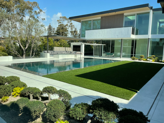 Landscaping: Bespoke Landscape Design - We delivered a bespoke landscape design tailored to our client’s vision of a modern oasis. The design masterfully integrates minimalist open-floor aesthetics with lush, curated flora to harmonize with the exterior architecture. By merging organic elements with industrial materials, we created a seamless interplay of textures and contrasts, achieving both form and function. The carefully selected vegetation and hardscaping materials were chosen not only for their visual appeal but also for their ability to enhance the tranquility and livability of the space, ensuring a dynamic yet inviting environment for the client’s family to enjoy.