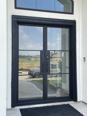 IRON DOORS CUSTOM FITTED - A significant transformation for a stunning house in Cinco Ranch! The homeowners chose to upgrade their standard wood doors to exquisite iron doors with glass. Our team executed the installation flawlessly, enhancing the home’s elegance and curb appeal. IRON DOORS CUSTOM FITTED - A significant transformation for a stunning house in Cinco Ranch! The homeowners chose to upgrade their standard wood doors to exquisite iron doors with glass. Our team executed the installation flawlessly, enhancing the home’s elegance and curb appeal.