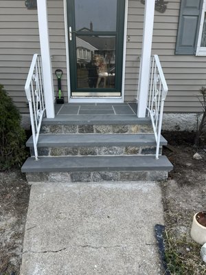 New front porch finished with bluestone threads and natural stone veneer January 2023 - The old front porch was in a terrible condition, and beyond saving so we ripped it out, dug and poured a new concrete foundation, rebuilt it using 12 inch cinder block (filled with metal reinforced concrete) ￼and finished it with bluestone threads and natural stone veneer ￼