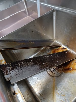 Kitchen Cleaning and Degreasing - Grill parts in a kitchen in need of cleansing Kitchen Cleaning and Degreasing - Grill parts in a kitchen in need of cleansing