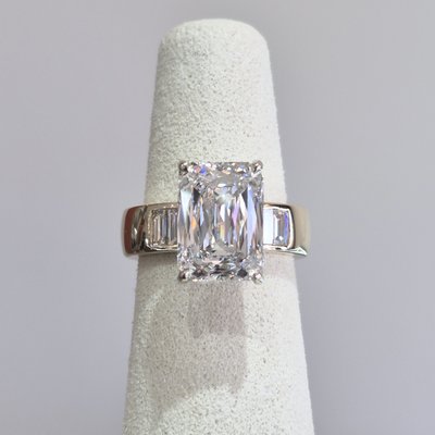 Custom Ring - Our customer brought in her own diamond, and together we brought her vision to life. After exploring multiple design options and CAD revisions, we created this custom setting featuring a wide band, baguette diamond accents, and a white gold head to enhance the brilliance and sparkle of the center stone. A truly one-of-a-kind piece made just for her. Custom Ring - Our customer brought in her own diamond, and together we brought her vision to life. After exploring multiple design options and CAD revisions, we created this custom setting featuring a wide band, baguette diamond accents, and a white gold head to enhance the brilliance and sparkle of the center stone. A truly one-of-a-kind piece made just for her.