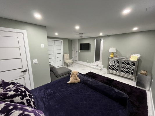 Garage-to-Suite Transformation - This complete remodel turned an outdated garage into a modern, functional living suite. The new design features a cozy bedroom, custom closets, and an integrated laundry area — all finished with sleek materials, soft lighting, and neutral tones. A perfect blend of comfort, efficiency, and contemporary style.