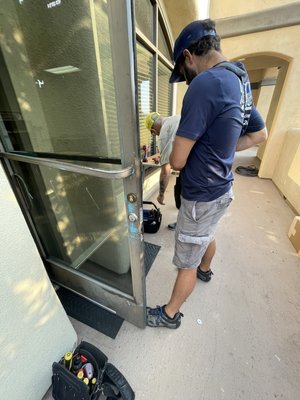 Installing new exit devices on a commercial building. - Today we were called out to school to add new exit device hardware and master key the entire facility.