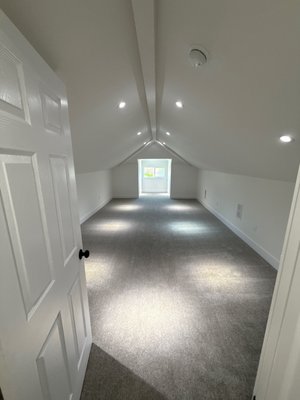 Attic Storage to Finished Loft Bedroom Conversion - We converted this unfinished attic space from basic storage into a fully finished loft bedroom. The project included framing, insulation, drywall, electrical upgrades, and code compliant egress improvements to transform the area into safe, comfortable living space.

We maximized the ceiling lines and layout to make the most of the existing footprint while adding proper lighting, HVAC integration, and new carpet flooring throughout. The result is a comfortable, functional bedroom that feels intentionally designed and seamlessly connected to the rest of the home.

This type of conversion is ideal for homeowners looking to add usable square footage without expanding the home’s footprint.