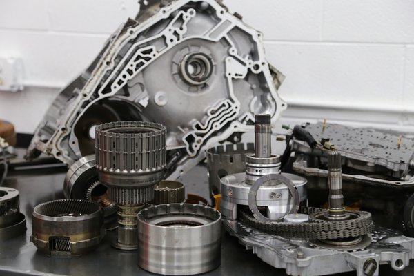 Understanding Transmission Rebuild: Causes and Failures - Transmissions are complex components of any vehicle, and understanding why they fail can save you time and money in the long run. Let's delve into the common causes and failures that lead to the need for a transmission rebuild.
Overheating: One of the most common reasons for transmission failure is overheating. This can be caused by towing heavy loads, habitual aggressive driving, or a lack of proper cooling. Overheating leads to the breakdown of transmission fluid, which is crucial for lubrication and cooling.
Fluid Leaks: Transmission fluid is the lifeblood of the system. Low fluid levels due to leaks can lead to inadequate lubrication and cooling, resulting in overheating and wear of the transmission’s internal components.
Wear and Tear from Rough Driving: Constant aggressive driving can expedite the wear and tear of transmission components. Frequent hard stops and starts, rapid acceleration, and driving in stop-and-go traffic regularly can strain the transmission.
Clutch Problems: In manual transmissions, clutch issues are a frequent culprit. The clutch can become worn or misaligned, leading to grinding gears and difficulty in shifting.
Solenoid Problems: Solenoids control the flow of fluid throughout the transmission. If they malfunction due to electrical issues or insufficient fluid levels, it can result in improper shifting or even prevent the vehicle from moving.
Torque Converter Issues: The torque converter can develop problems like worn bearings or damaged fins, leading to slipping, overheating, or shuddering.
Sensor and Computer Issues: Modern vehicles rely on computers and sensors to operate their transmissions. Faulty sensors or computer problems can lead to incorrect shifting patterns, which wear out the transmission faster.
Lack of Maintenance: Regular maintenance is crucial for a transmission's longevity. Neglecting maintenance like fluid changes or ignoring warning signs like strange noises or grinding can lead to major failures.
When these issues are not addressed promptly, they often necessitate a transmission rebuild - a process where the transmission is disassembled, inspected, worn or damaged parts are replaced, and then reassembled and reinstalled into the vehicle. It's a detailed process that requires expertise and precision, and understanding these causes can help vehicle owners prevent major transmission failures. Understanding Transmission Rebuild: Causes and Failures - Transmissions are complex components of any vehicle, and understanding why they fail can save you time and money in the long run. Let's delve into the common causes and failures that lead to the need for a transmission rebuild.
Overheating: One of the most common reasons for transmission failure is overheating. This can be caused by towing heavy loads, habitual aggressive driving, or a lack of proper cooling. Overheating leads to the breakdown of transmission fluid, which is crucial for lubrication and cooling.
Fluid Leaks: Transmission fluid is the lifeblood of the system. Low fluid levels due to leaks can lead to inadequate lubrication and cooling, resulting in overheating and wear of the transmission’s internal components.
Wear and Tear from Rough Driving: Constant aggressive driving can expedite the wear and tear of transmission components. Frequent hard stops and starts, rapid acceleration, and driving in stop-and-go traffic regularly can strain the transmission.
Clutch Problems: In manual transmissions, clutch issues are a frequent culprit. The clutch can become worn or misaligned, leading to grinding gears and difficulty in shifting.
Solenoid Problems: Solenoids control the flow of fluid throughout the transmission. If they malfunction due to electrical issues or insufficient fluid levels, it can result in improper shifting or even prevent the vehicle from moving.
Torque Converter Issues: The torque converter can develop problems like worn bearings or damaged fins, leading to slipping, overheating, or shuddering.
Sensor and Computer Issues: Modern vehicles rely on computers and sensors to operate their transmissions. Faulty sensors or computer problems can lead to incorrect shifting patterns, which wear out the transmission faster.
Lack of Maintenance: Regular maintenance is crucial for a transmission's longevity. Neglecting maintenance like fluid changes or ignoring warning signs like strange noises or grinding can lead to major failures.
When these issues are not addressed promptly, they often necessitate a transmission rebuild - a process where the transmission is disassembled, inspected, worn or damaged parts are replaced, and then reassembled and reinstalled into the vehicle. It's a detailed process that requires expertise and precision, and understanding these causes can help vehicle owners prevent major transmission failures.