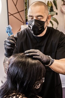 Density Treatment - If you're a woman looking to add density to your hair, scalp Micropigmentation (SMP) can be a great option for you. SMP is a non-invasive cosmetic procedure that involves depositing tiny pigment dots onto the scalp to mimic the appearance of hair follicles. It is commonly used to create the illusion of a fuller head of hair and add density to thinning areas.
During the SMP procedure, a skilled technician will carefully analyze your scalp and hair pattern to determine the best placement and color of the pigment dots. The dots are strategically placed in the areas where you want to enhance density, creating the appearance of thicker hair.
SMP is a versatile solution that can be customized to your specific needs. Whether you have a receding hairline, thinning crown, or overall hair loss, the procedure can help you achieve a more natural and fuller look. It is suitable for women with all hair types and can be combined with other hair restoration treatments for optimal results.
It's important to consult with a qualified SMP specialist who has experience working with women to discuss your goals, expectations, and any concerns you may have. They will guide you through the process, provide recommendations, and ensure that you achieve the desired density and natural-looking results.
Remember, scalp Micropigmentation is a cosmetic procedure, and like any other treatment, it has its limitations. It's essential to have realistic expectations and understand that SMP does not stimulate hair growth or address the underlying causes of hair loss. However, it can significantly improve the appearance of thinning hair and boost your confidence. Density Treatment - If you're a woman looking to add density to your hair, scalp Micropigmentation (SMP) can be a great option for you. SMP is a non-invasive cosmetic procedure that involves depositing tiny pigment dots onto the scalp to mimic the appearance of hair follicles. It is commonly used to create the illusion of a fuller head of hair and add density to thinning areas.
During the SMP procedure, a skilled technician will carefully analyze your scalp and hair pattern to determine the best placement and color of the pigment dots. The dots are strategically placed in the areas where you want to enhance density, creating the appearance of thicker hair.
SMP is a versatile solution that can be customized to your specific needs. Whether you have a receding hairline, thinning crown, or overall hair loss, the procedure can help you achieve a more natural and fuller look. It is suitable for women with all hair types and can be combined with other hair restoration treatments for optimal results.
It's important to consult with a qualified SMP specialist who has experience working with women to discuss your goals, expectations, and any concerns you may have. They will guide you through the process, provide recommendations, and ensure that you achieve the desired density and natural-looking results.
Remember, scalp Micropigmentation is a cosmetic procedure, and like any other treatment, it has its limitations. It's essential to have realistic expectations and understand that SMP does not stimulate hair growth or address the underlying causes of hair loss. However, it can significantly improve the appearance of thinning hair and boost your confidence.