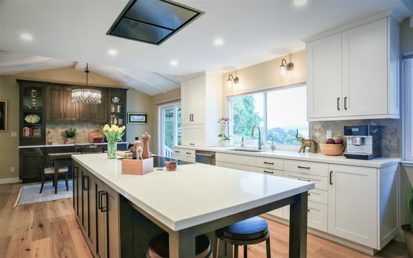 Folsom Lake View Kitchen - This client needed a full refresh. We met and reviewed all the elements that needed to be changed and how the new layout needed to function. From new cabinets and countertops, to flooring and appliances, this job needed every element updated. We worked together and came up with this stunning 2 tone kitchen with high end appliances and incredible storage solutions!