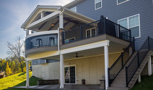 Open Porch in Schwenksville, PA - This cozy open porch features Azek Decking Vintage Collection, color Coastline, decking, American Series Aluminum railing, and a curved breakfast bar. The real eyecatcher of this project is the stunning cathedral ceiling with white vinyl shiplap planks. We also installed Phoenix step riser lights, TimberTech post accent lights, and hanging light fixtures that the customer provided to complete this look. Open Porch in Schwenksville, PA - This cozy open porch features Azek Decking Vintage Collection, color Coastline, decking, American Series Aluminum railing, and a curved breakfast bar. The real eyecatcher of this project is the stunning cathedral ceiling with white vinyl shiplap planks. We also installed Phoenix step riser lights, TimberTech post accent lights, and hanging light fixtures that the customer provided to complete this look.