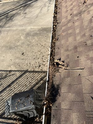 Gutter cleaning - This was our budget cleaning. The downspouts were clogged, causing the gutters to overflow. We removed all the debris from the gutters and unclog the downspouts so they could work functionally. For a few extra dollars we offer a premium gutter cleaning service that follows up with a cleaning solution applied with a low pressure wash. It makes the gutters look great by removing all the black organic matter at the bottom of the gutter as well as preventing the organic matter, build up down the road. Gutter cleaning - This was our budget cleaning. The downspouts were clogged, causing the gutters to overflow. We removed all the debris from the gutters and unclog the downspouts so they could work functionally. For a few extra dollars we offer a premium gutter cleaning service that follows up with a cleaning solution applied with a low pressure wash. It makes the gutters look great by removing all the black organic matter at the bottom of the gutter as well as preventing the organic matter, build up down the road.