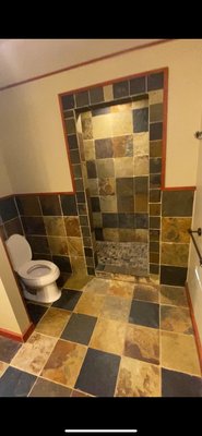 K's Bathroom Remodel - For this remodel, our team performed a complete demo & removed a wall to open up the available space. From there, we installed tile flooring and built a custom tile shower with built-in shower bench. We replaced the old vanity with a large, more modern his and hers vanity. This project was completed in 9 days.