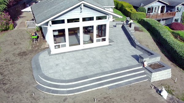 Raised Patio - We removed an existing wood patio and created a unique space with pavers and blocks to better suit the growing families needs.