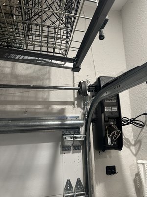 Wall Mounted Garage Door Opener Install - Wall-Mount Garage Door Opener Installation
Installed a new wall-mount garage door opener to maximize overhead storage space and provide ultra-quiet operation. Wall-mount openers eliminate the traditional ceiling-mounted rail system, creating a cleaner look and more usable garage ceiling space. This installation includes smooth operation, built-in Wi-Fi connectivity, battery backup capability, and enhanced security features. Perfect for garages with high ceilings, storage racks, or customers looking for a modern garage door opener solution. Wall Mounted Garage Door Opener Install - Wall-Mount Garage Door Opener Installation
Installed a new wall-mount garage door opener to maximize overhead storage space and provide ultra-quiet operation. Wall-mount openers eliminate the traditional ceiling-mounted rail system, creating a cleaner look and more usable garage ceiling space. This installation includes smooth operation, built-in Wi-Fi connectivity, battery backup capability, and enhanced security features. Perfect for garages with high ceilings, storage racks, or customers looking for a modern garage door opener solution.