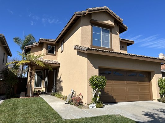 Escondido Exterior - This was a full exterior paint job. It was first power washed and then prepped and painted. The main stucco color was painted using Sherwin Williams Super Paint Exterior Flat in the color Vista Paint Tailored Tan. The pop outs, eaves, fascia, trim & rain gutters were painted using Sherwin Williams Super Paint Exterior Flat in the color Vista Paint Alpha Male. The roll down garage door and front door were painted in Sherwin Williams Emerald Urethane Satin in the color Vista Paint Alpha Male. Escondido Exterior - This was a full exterior paint job. It was first power washed and then prepped and painted. The main stucco color was painted using Sherwin Williams Super Paint Exterior Flat in the color Vista Paint Tailored Tan. The pop outs, eaves, fascia, trim & rain gutters were painted using Sherwin Williams Super Paint Exterior Flat in the color Vista Paint Alpha Male. The roll down garage door and front door were painted in Sherwin Williams Emerald Urethane Satin in the color Vista Paint Alpha Male.