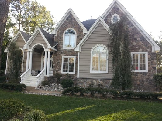 Curb appeal galore! - A dramatic change in appearance converting from stucco to stone, vinyl siding, soffit, trim, post, rails and deck Curb appeal galore! - A dramatic change in appearance converting from stucco to stone, vinyl siding, soffit, trim, post, rails and deck