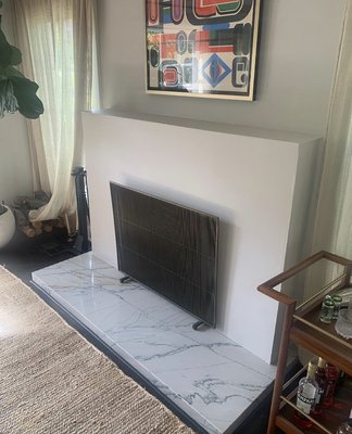Fireplace Hearth Extension Upgrade/Repair - This fireplace had combustible materials (drywall) around the opening and hearth. We remove the drywall, replaced it with cement board, and custom-built/installed a beautiful quartz stone hearth extension. This fireplace remodel helped ensure the safety of its users and allowed for a much needed improved overall look to the clients home.
Call us today for your Fireplace Remodel! Fireplace Hearth Extension Upgrade/Repair - This fireplace had combustible materials (drywall) around the opening and hearth. We remove the drywall, replaced it with cement board, and custom-built/installed a beautiful quartz stone hearth extension. This fireplace remodel helped ensure the safety of its users and allowed for a much needed improved overall look to the clients home.
Call us today for your Fireplace Remodel!