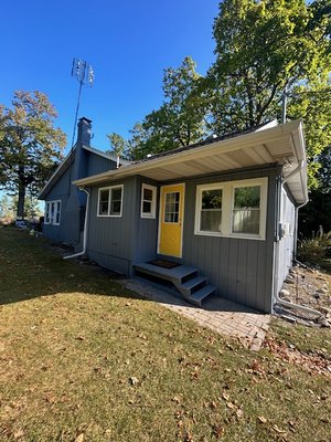 Exterior painting in rondeau - This home had been previously painted and it was all chipped off. So we power washed it, sanded and scraped old paint, and gave it a freshen up!