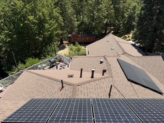 Lytle Creek Roof & Exterior Renovation - We started this project with a complete roof replacement, including the removal and reinstallation of the existing solar panels. Because the home is located in Lytle Creek, where snow and moisture can be a concern, the homeowner requested a full ice and water shield system across the entire roof for added protection, which we were happy to provide.

In addition to the roofing work, we installed new gutters around the home, replaced damaged siding in multiple areas, including sections near the roofline and at ground level, and rebuilt the deteriorated deck steps.

To complete the transformation, we painted the entire front exterior of the home, giving it a fresh, updated appearance. This project is a great example of the value we provide by helping homeowners complete multiple exterior improvements under one contractor and at an affordable price.