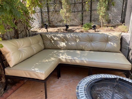 Outdoor Cushions Modification - These outdoor cushions were transform by using the inside of the old pillows and the foam from the seats to make new long cushions to keep them in their place. We use marine vinyl to we stand the weather. The original design was plan without the buttons on the back cushions but they look a little plain so the client decided to add buttons to give it character. Outdoor Cushions Modification - These outdoor cushions were transform by using the inside of the old pillows and the foam from the seats to make new long cushions to keep them in their place. We use marine vinyl to we stand the weather. The original design was plan without the buttons on the back cushions but they look a little plain so the client decided to add buttons to give it character.