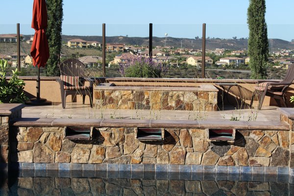 Scripps Ranch New Construction Landscape - A new construction home in Scripps Ranch that Panjia was selected for to complete a design and build out of all new landscaping for front, sides and backyard. This project included a patio cover with outdoor kitchen, patio, walkway and pool deck pavers, retaining, seating and decorative walls, swimming pool & spa, fire pit, bocce ball court, garden, water features, basketball key, lush planting, irrigation and drainage systems, landscape lighting. Scripps Ranch New Construction Landscape - A new construction home in Scripps Ranch that Panjia was selected for to complete a design and build out of all new landscaping for front, sides and backyard. This project included a patio cover with outdoor kitchen, patio, walkway and pool deck pavers, retaining, seating and decorative walls, swimming pool & spa, fire pit, bocce ball court, garden, water features, basketball key, lush planting, irrigation and drainage systems, landscape lighting.