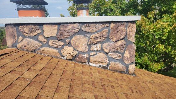 Chimney Tuckpointing - This chimney had water leaking into the house. We tuckpointed it from the roofline up and resealed the flashing. Chimney Tuckpointing - This chimney had water leaking into the house. We tuckpointed it from the roofline up and resealed the flashing.