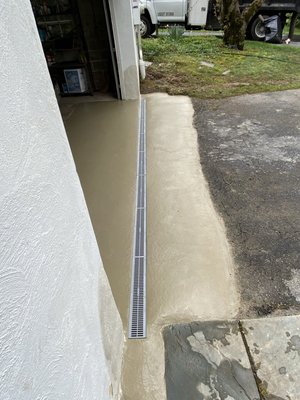 Garage Drainage - Garage leaking and concrete slab settlement.  Drainage install and concrete repair.