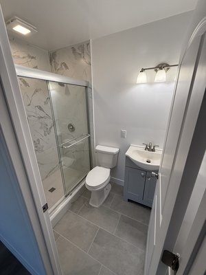 Bathroom remodel - We took this small dark bathroom and made it into a full size bathroom with a nice tile shower and floors.