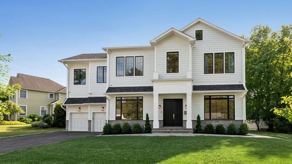 4000 SF New Build - We recently completed a 4,000 sq ft custom home with 4 bedrooms and 3.5 bathrooms, designed with luxury and functionality in mind. This center hall colonial features 13-foot ceilings, custom millwork, and a chef’s kitchen equipped with Wolf, Subzero, and Miele appliances.

The second floor showcases herringbone white oak floors, coffered ceilings, and a spa-like primary suite with radiant heated floors and a custom walk-in closet. The finished basement includes a rec room, full bath, kitchenette, and a custom dog grooming station.