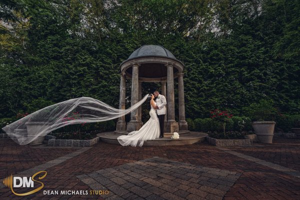 Weddings starting at $1,995 - At Dean Michaels Studio, our images are vibrant, creative, and full of life. They capture moments that are fun, romantic, and deeply sentimental. Renowned for blending traditional wedding portraiture with a candid, photojournalistic approach, our team has crafted a distinctive style of wedding photography.

Our mission is to tell your story through breathtaking imagery. As greater New Jersey’s premier wedding photography studio, we see ourselves not just as photographers, but as artists dedicated to creating unique and expressive photos. With extensive experience in portraiture, commercial, and editorial photography, we’ve mastered a variety of styles to beautifully document your wedding from every perspective. Have a specific vision in mind? We’re here to bring it to life.