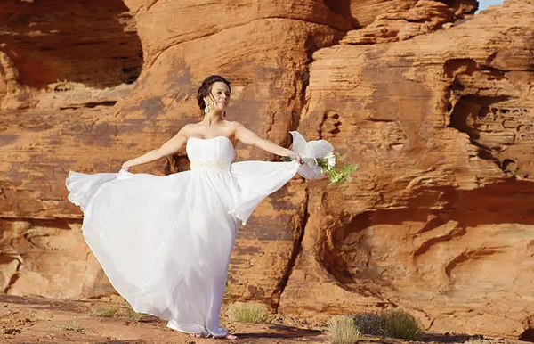 Valley of Fire Weddings by Limosuine - Your private luxury transportation will transport you on a scenic desert drive one hour north of Las Vegas to a land where brilliantly colored arches of sandstone formations will serve as a dramatic backdrop to your special day. One of Nevada’s State Parks and a protected environment, it is truly a magnificent and unique place of tranquility and wonder. Blockbuster movies such as Viva Las Vegas, Total Recall and Star Trek were filmed here.