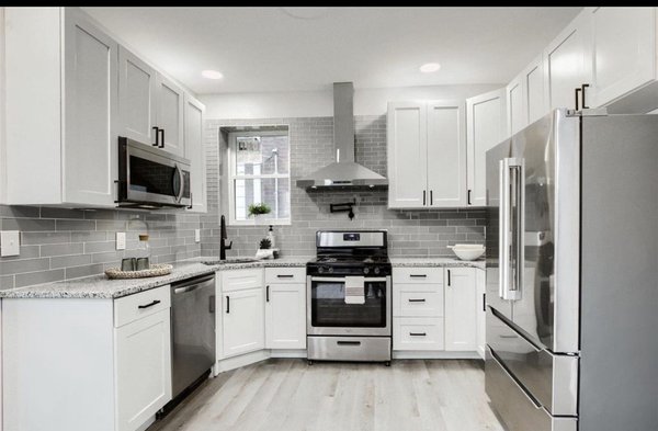 Kitchen remodel at  Wyoming - Indulge in the enchanting allure of this stunning kitchen masterpiece we crafted in the heart of Saint Louis! Behold the seamless open-concept design, where boundaries vanish, and culinary creativity knows no limits. With cabinets featuring soft-close doors and drawers embraced by sturdy plywood frames, every touch exudes elegance. Granite countertops dance gracefully with sleek stainless steel appliances, rendering this kitchen a dreamlike symphony of opulence and functionality. Feast your eyes on this mesmerizing transformation that beckons you to savor life's delectable moments!