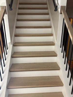 Staircase - Replaced all treads and risers and built new newel posts, handrails, and balusters.  Painted all the trim.