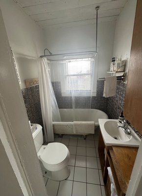 Bathroom Remodel in South Austin - We tore out the old bath and built a custom shower pan, changed the window opening in for more privacy, put over 1500 subway tiles on the walls and laid penny tiles on the floor. We renovated the old cabinet installing a marble countertop, and laid mosaic tiles on the bathroom floor. Redid the flooring in the hall with hardwood that went well with the old hardwood in the rest of the house. Bathroom Remodel in South Austin - We tore out the old bath and built a custom shower pan, changed the window opening in for more privacy, put over 1500 subway tiles on the walls and laid penny tiles on the floor. We renovated the old cabinet installing a marble countertop, and laid mosaic tiles on the bathroom floor. Redid the flooring in the hall with hardwood that went well with the old hardwood in the rest of the house.