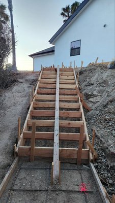 Concrete Walkway & Stair Forms - We prepared and installed professional wood forms with rebar reinforcement for a new concrete walkway and outdoor stairs. This ensures strength, durability, and a clean finish once the concrete is poured. A solid foundation for a safe and long-lasting entryway.