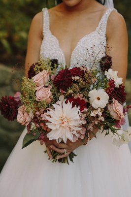 Fall wedding at The Garrison - We delivered on the vision of using lush local flowers and foliage to bring nature inside for this fall wedding. We found ways to repurpose certain elements, such as using the arbor florals to decorate the sweetheart table and using the bridesmaids bouquets throughout the reception. Fall wedding at The Garrison - We delivered on the vision of using lush local flowers and foliage to bring nature inside for this fall wedding. We found ways to repurpose certain elements, such as using the arbor florals to decorate the sweetheart table and using the bridesmaids bouquets throughout the reception.