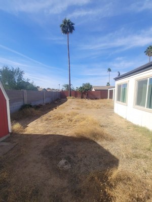 Back yard remodeling/grading - Back Yard was all dirt and wen it rain their back yard patio would flood, we installed a gutter line connected to an underground water deposit hole. We re-garded the back yard to slope away from property, added artificial grass and some gravel to give it a whole new look