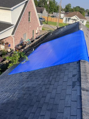 Emergency roof tarp - Blue tarp to temporarily fix roof leaks. Emergency roof tarp - Blue tarp to temporarily fix roof leaks.