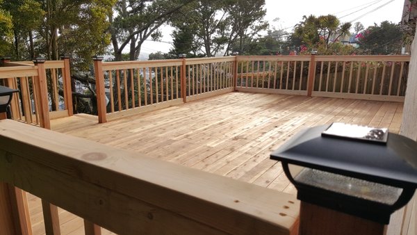 Decking wood - This deck was downhill so we had to support it with a few beams and concrete Decking wood - This deck was downhill so we had to support it with a few beams and concrete