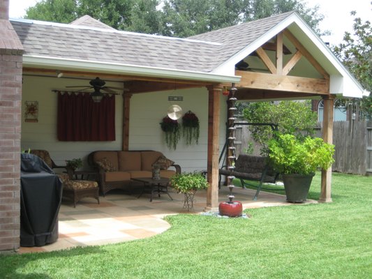 Covered Porch with Pattern Concrete - Custom gable roof with mansard style roof and stamped pattern concrete patio below. Covered Porch with Pattern Concrete - Custom gable roof with mansard style roof and stamped pattern concrete patio below.