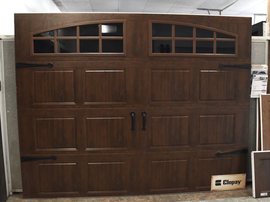 CLOPAY GALLERY IS ONE OF OUR FAVORITE DOORS AT PIONEER DOOR INC - Clopay Gallery is one of our favorite doors here at PDI. They offer a beautiful stamped steel door in wood grain colors or standard colors like white or even black. This is a great option if you don’t want to spend the money on a custom stained grade door and don’t want any maintenance to the face of the door. The face of this door has a limited lifetime warranty on the color. You wont have to worry about re staining the door every few years, the beautiful wood tone will last. CLOPAY GALLERY IS ONE OF OUR FAVORITE DOORS AT PIONEER DOOR INC - Clopay Gallery is one of our favorite doors here at PDI. They offer a beautiful stamped steel door in wood grain colors or standard colors like white or even black. This is a great option if you don’t want to spend the money on a custom stained grade door and don’t want any maintenance to the face of the door. The face of this door has a limited lifetime warranty on the color. You wont have to worry about re staining the door every few years, the beautiful wood tone will last.