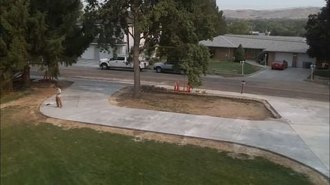 Concrete Driveway with a new turnaround and two point access - This customer had a busted irrigation pipe and decided it was time to upgrade his dirt/concrete driveway to a large concrete driveway with a turn-around and two point access to the road. He love it and so did his neighbors! Concrete Driveway with a new turnaround and two point access - This customer had a busted irrigation pipe and decided it was time to upgrade his dirt/concrete driveway to a large concrete driveway with a turn-around and two point access to the road. He love it and so did his neighbors!
