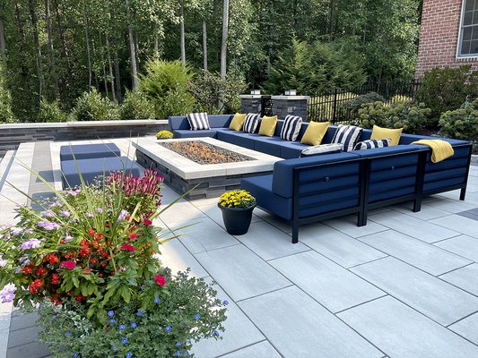 Resort Living in Your Own Backyard - East Coast designed and built this new backyard full of the experiences and luxury of resort living. Working from a palette of stone, plantings and lighting, we delivered beauty, durability and enjoyment for both day and night. Our happy clients invite family and friends to enjoy grilling, dining, fireside relaxing, swimming and other fun activities.

FEATURES: 

> Expansive patio
> Gas fire pit
> Outdoor kitchen 
> Pavilion
> Pool area
> Outdoor lighting
> Landscaping
> Drainage system