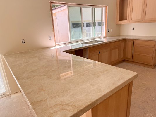 Taj Mahal quartzite countertop installation project! - Check out this stunning transformation with our Taj Mahal quartzite countertops! The new installation made the space look more open, bright, and modern with its wide, sleek, and shiny finish. Our expert craftsmanship ensures durability and a luxury feel that elevates any kitchen. Ready to upgrade your space? Contact Stoneworks Countertops for your next project!