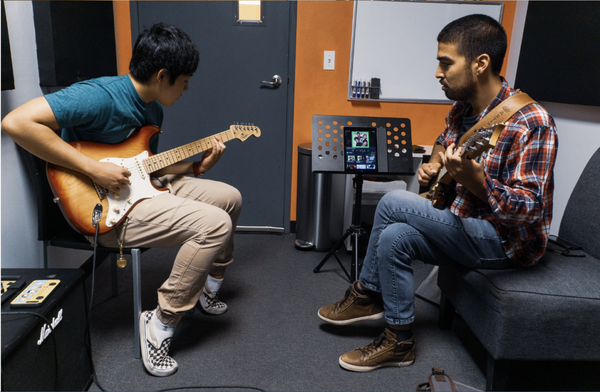 Guitar Lessons - Our approach to guitar lessons and bass guitar lessons is all about getting students to start playing guitar from day one! It doesn’t always mean playing full-blown chords or songs, but depending on the student’s age, we like to get them to start actually experiencing what it feels like to strum the guitar and begin to experience how fun and exciting it is.
Our guitar instructors are hired based on many criteria and one of which is their ability to teach all levels and types of students. Guitar lessons and bass guitar lessons should be accessible to all but not everyone will respond to each teaching approach the same. That’s why we make sure our guitar instructors tailor their lesson to the student and make sure that the primary goals of each student are met no matter what age they are, what level they are at, or what style they are trying to learn. Guitar Lessons - Our approach to guitar lessons and bass guitar lessons is all about getting students to start playing guitar from day one! It doesn’t always mean playing full-blown chords or songs, but depending on the student’s age, we like to get them to start actually experiencing what it feels like to strum the guitar and begin to experience how fun and exciting it is.
Our guitar instructors are hired based on many criteria and one of which is their ability to teach all levels and types of students. Guitar lessons and bass guitar lessons should be accessible to all but not everyone will respond to each teaching approach the same. That’s why we make sure our guitar instructors tailor their lesson to the student and make sure that the primary goals of each student are met no matter what age they are, what level they are at, or what style they are trying to learn.