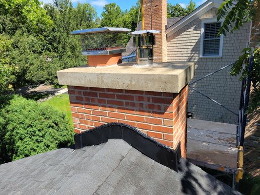 chimney rebuild, furnace and water heater liner. - this chimney was rebuild due to deterioration and water leaks. we also installed  a furnace and water heater liner because moisture and gases was seeping through all the cracked tiles. the owner does not have to worry about venting or humidity problems.